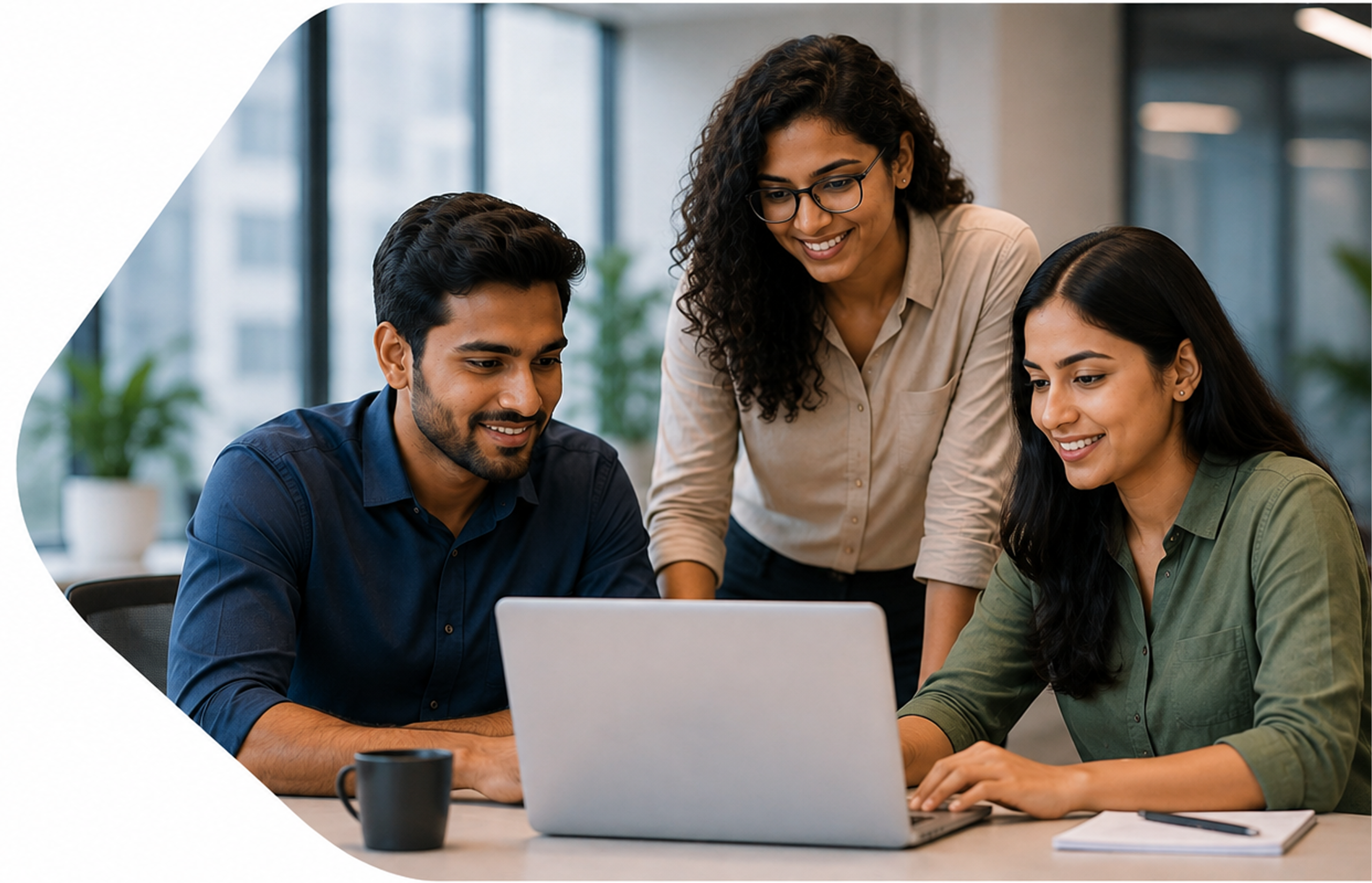 Intelicore colleagues collaborating around a laptop